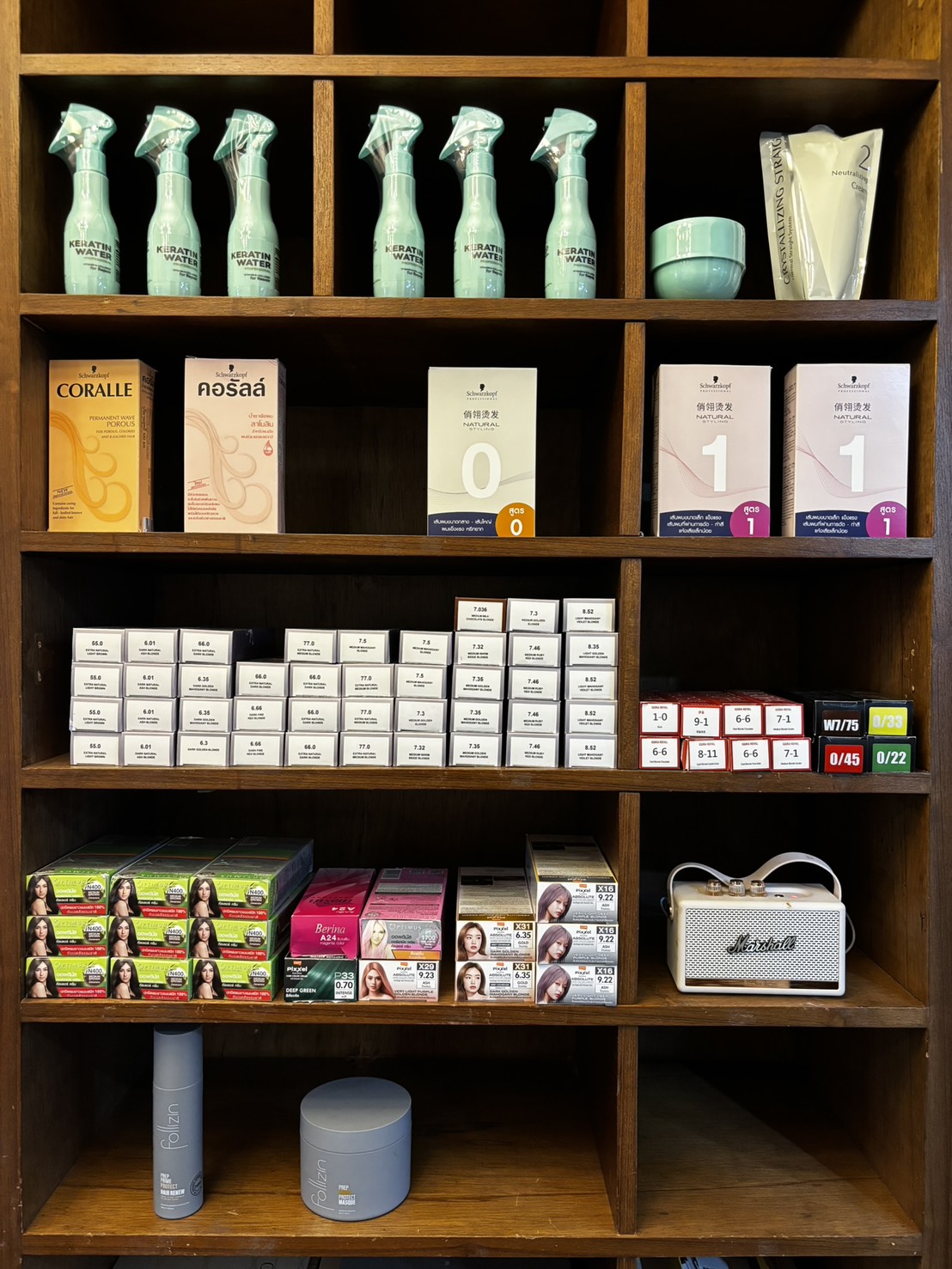 The colour wall — Schwarzkopf Coralle and Natural Styling boxes, numbered Igora Royal tubes, retail colour boxes and Follizin scalp care